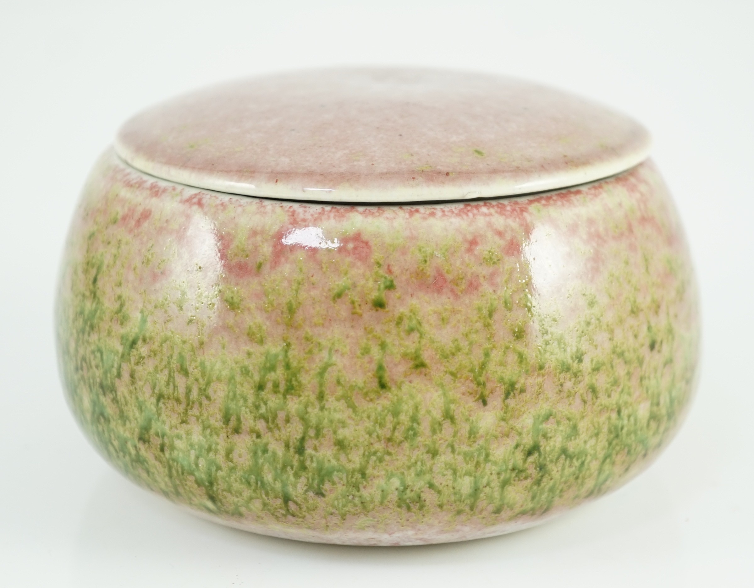 A Chinese peachbloom glazed weiqi stone box and cover, 20th century, 13.5cm diameter